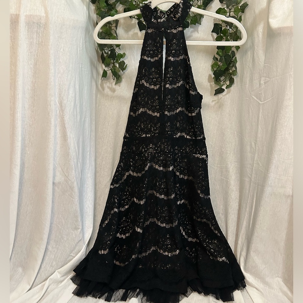 Lace black formal dress. Knee length, open back dress.